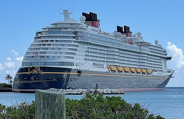 Disney Wish cruise ship docked at Castaway Cay, the private island destination for Disney Cruise Line, departing from Port Canaveral FL.