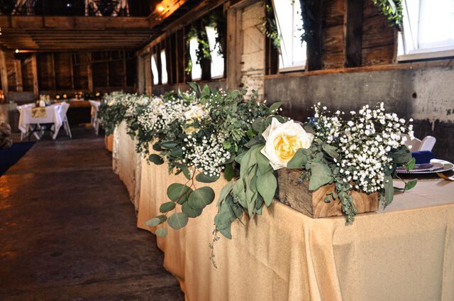 Rustic flowers at head table