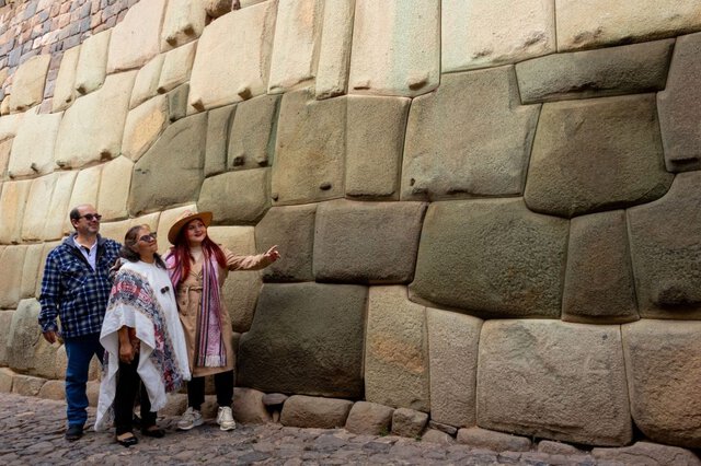 Ancient ruins of Machu Picchu in the Andes mountains, featured in a Peru travel guide.
