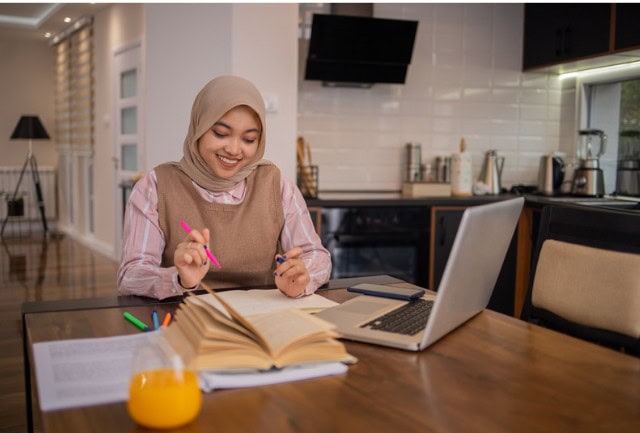 Child learning to code on a laptop, representing AI and digital skills education at Asra Hub