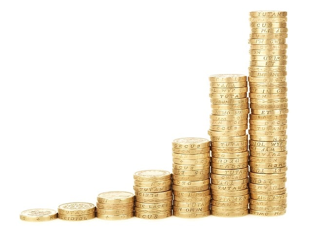 Stacked gold coins representing financial growth and investment success.