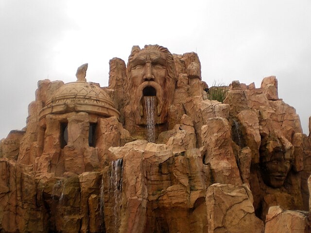 Poseidon's Fury statue with water flowing from its mouth at Universal's Islands of Adventure
