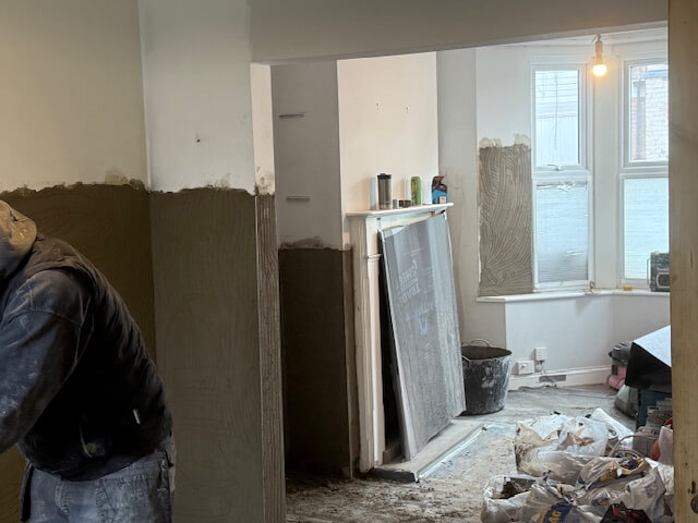 Specialist backing render applied to alcoves and fireplace walls to prevent moisture