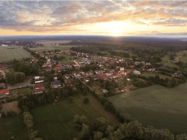 ariel shot of rural town at sundown