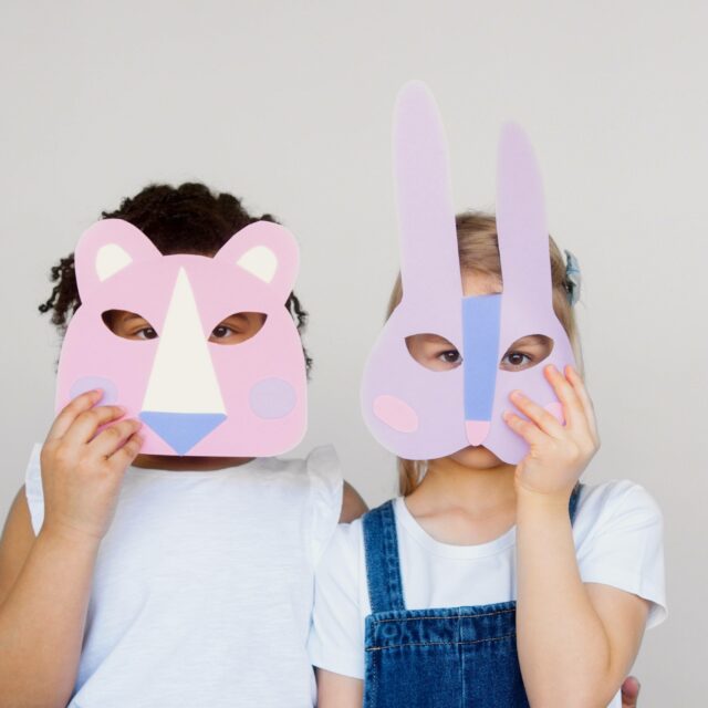 Two children were two different animal masks