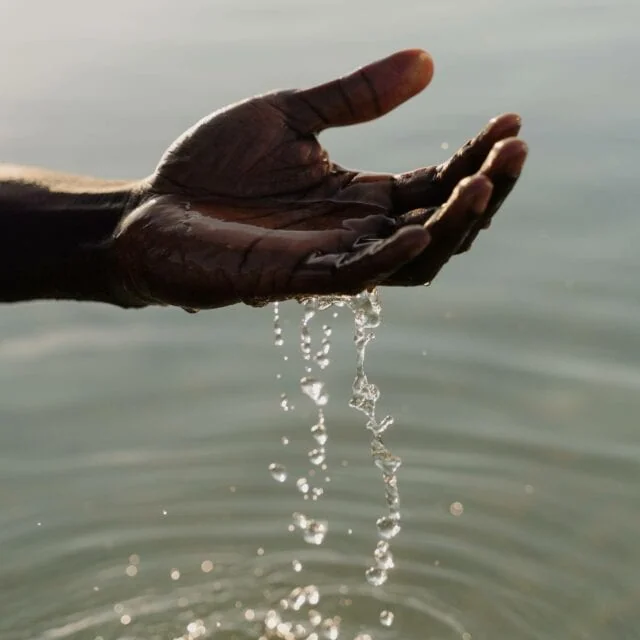 Stages Of Grief: Water passes through a hand