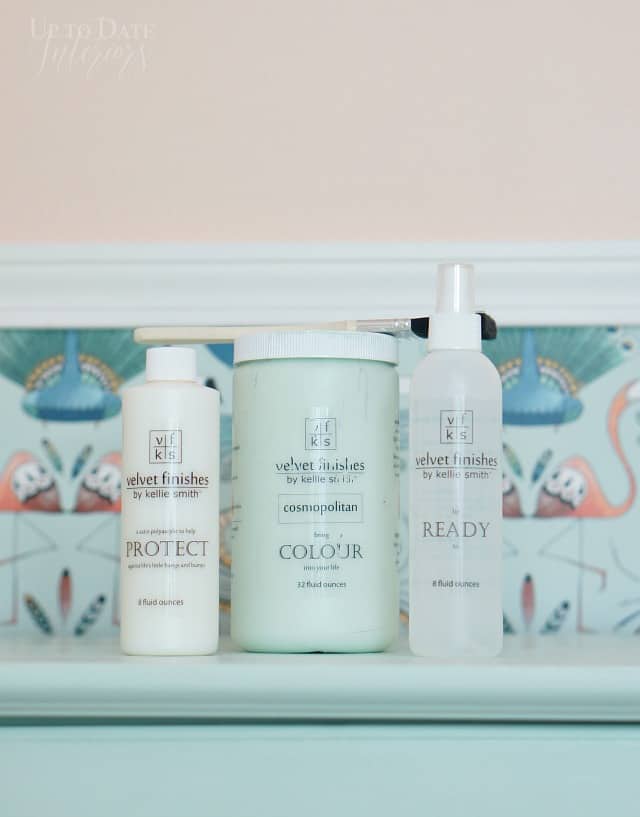 Velvet Finishes Cosmopolitan painted Dresser-the best paint for furniture without sanding- in mint green against a green bird wallpaper