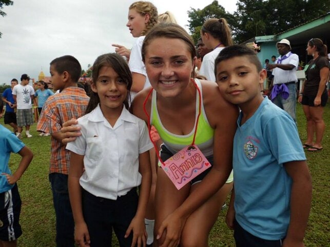 Annie with local school children in Costa Rica