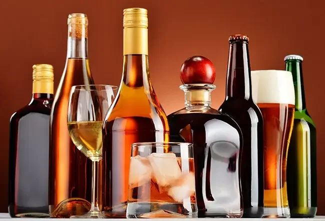 Alcohol bottles representing beverages detected by ETG test.