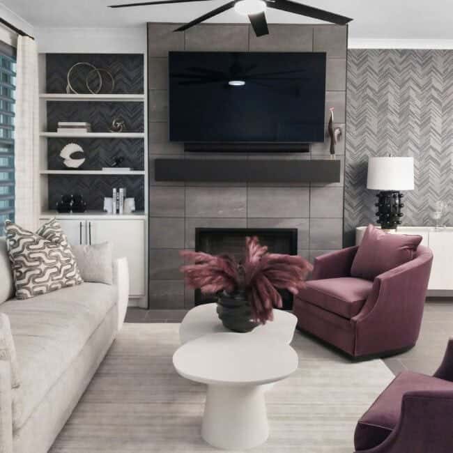 Stylish living room with fireplace, wall-mounted TV, and contemporary furniture.