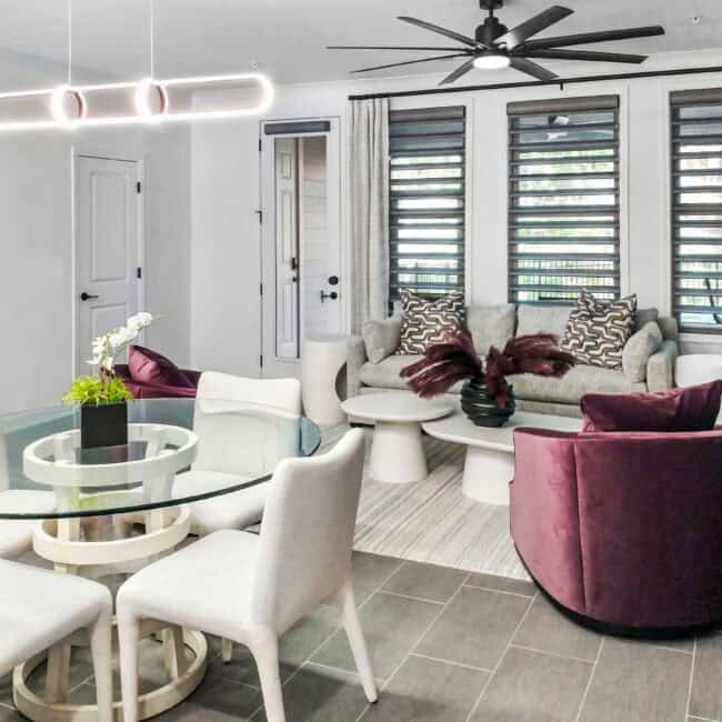 Bright living space with neutral tones, plush seating, and decorative accents.