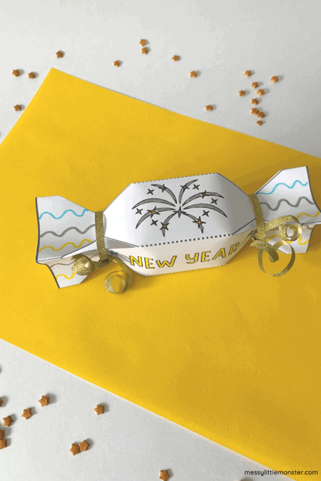 party crackers paper crafts featuring a yellow and white backdrop and sparkly confetti