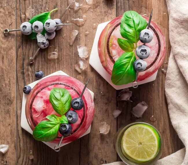 Basil Blueberry Margaritas from above with scattered ice