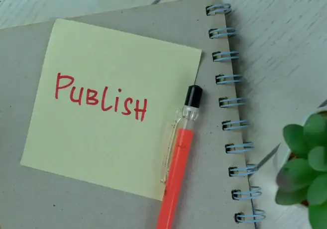 A blogger seated at his workdesk