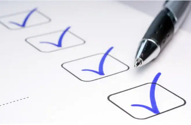 A Notepad with a List of Best Customers and a Pen