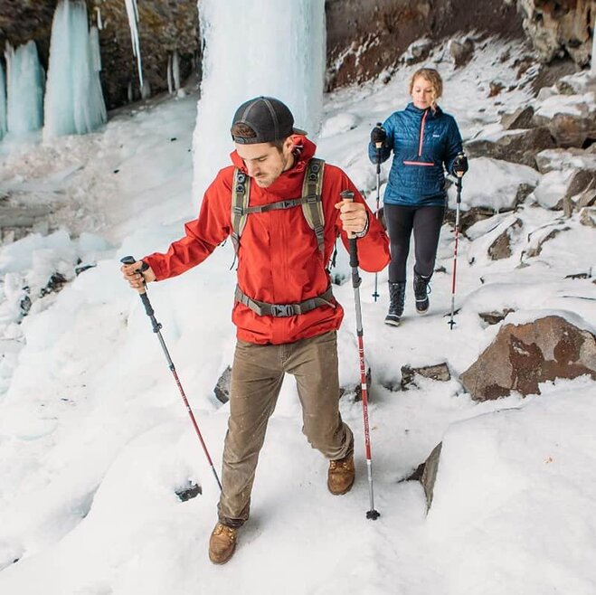 two-people-with-trekking-poles