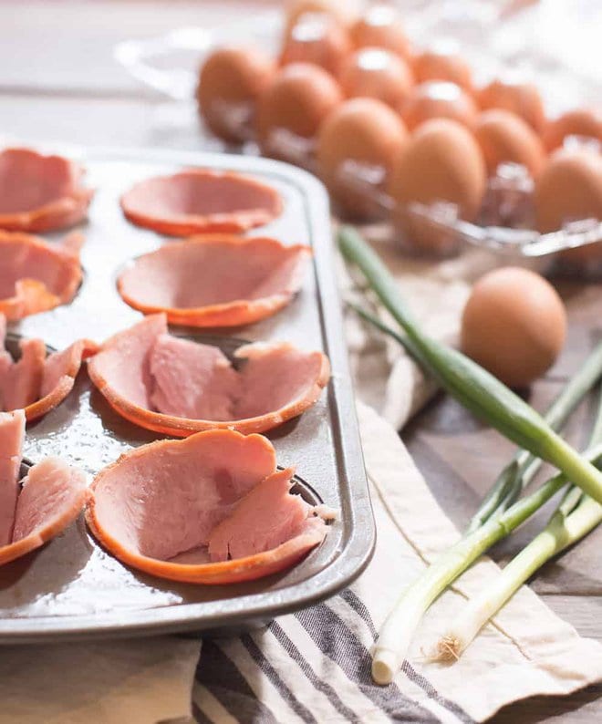 Ham stuffed into muffin tin for ham and egg cups