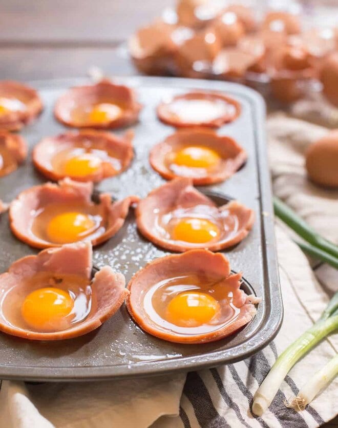 Raw Eggs in ham cups in a muffin tin