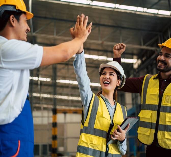 Warehouse Workers High Five