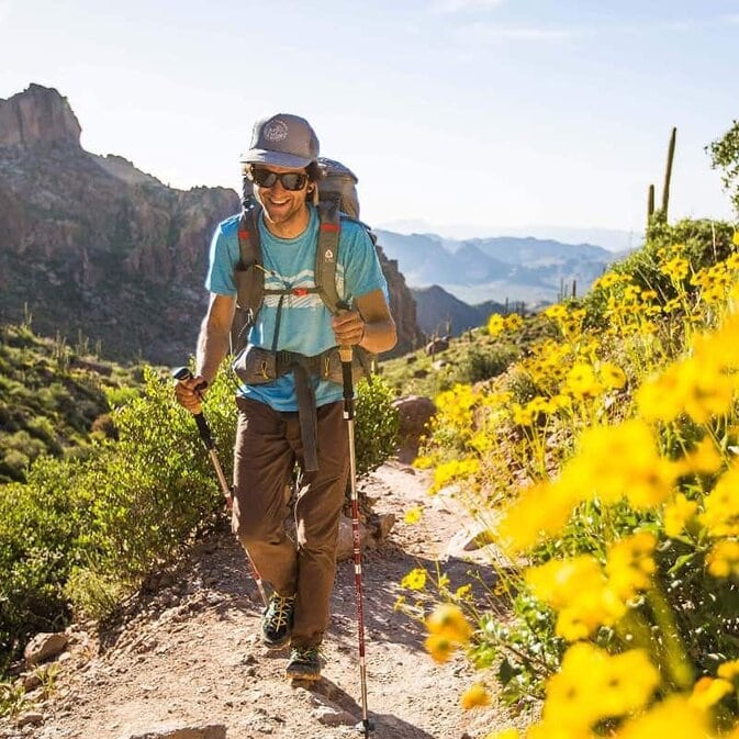 a-man-with-trekking-poles