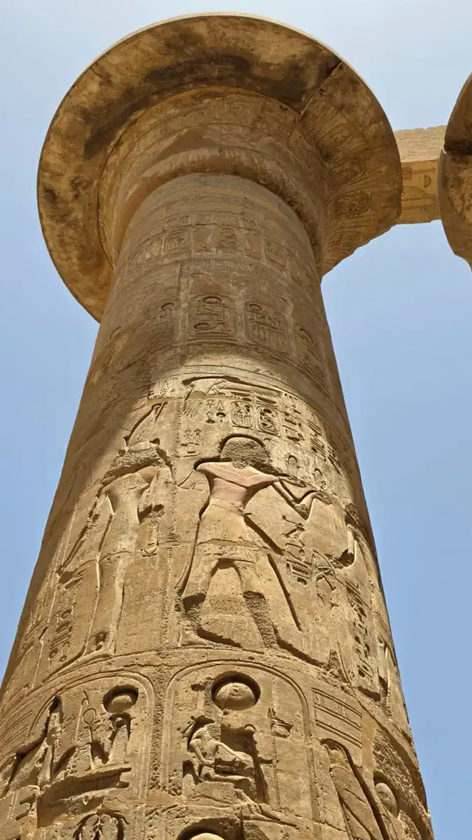 Carved offering scenes on a column at Karnak Temple in Luxor
