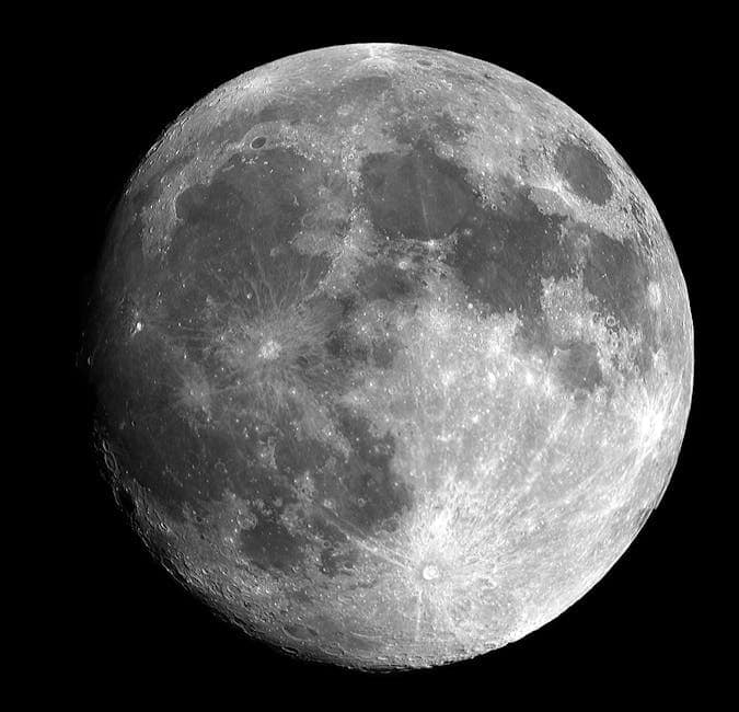 Captivating black and white image of the full moon showcasing intricate lunar details.