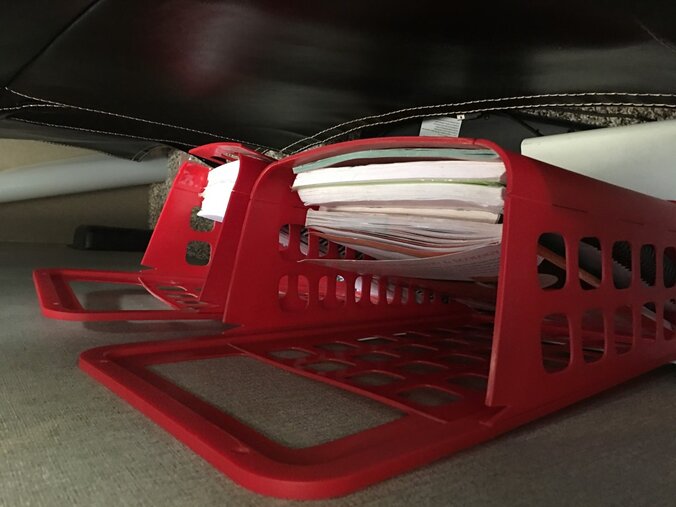 These are the main red IKEA bins I mentioned above all nicely stowed behind our theater seating.