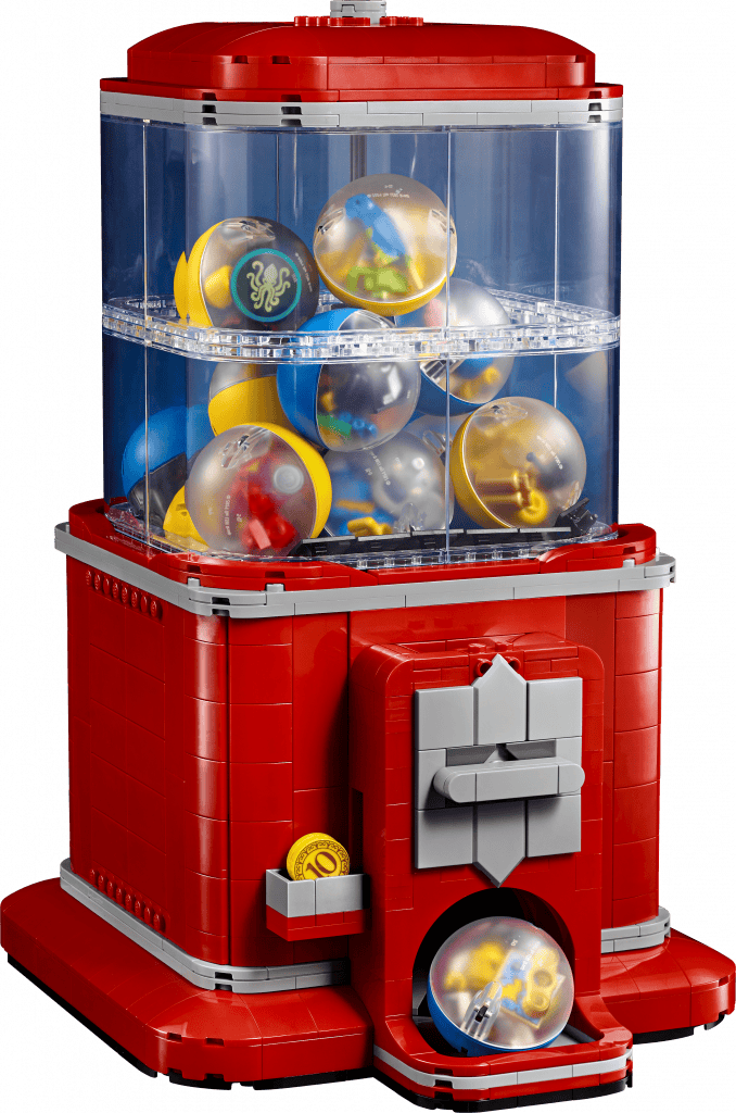 A colourful LEGO brick built red vending machine filled with gumball-sized toys, set against a plain background.