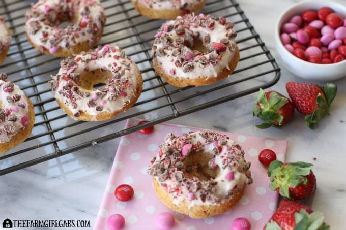 It's the season of love, and what better way to celebrate than with a sweet ending like these Strawberries And Cream Doughnuts topped with M&M's® Strawberry. Ad #SendSweetness