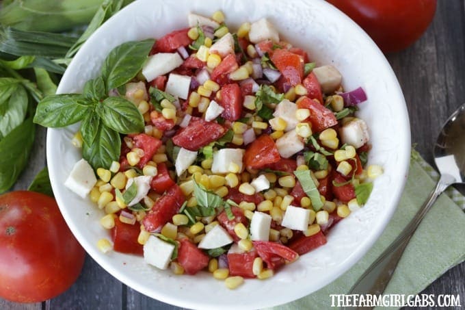 Garden fresh Tomatoes, corn and basil pair up to form the perfect trio in this delicious Tomato Corn And Basil Salad!