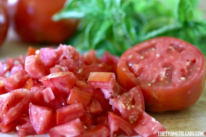 Garden fresh Tomatoes, corn and basil pair up to form the perfect trio in this delicious Tomato Corn And Basil Salad!