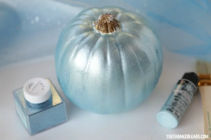 Your little princess will love making this beautiful DIY Disney Cinderella Pumpkin for Halloween. This no-carve pumpkin craft is bedazzled with gems, tulle and metallic blue paint to match Cinderella's gown.