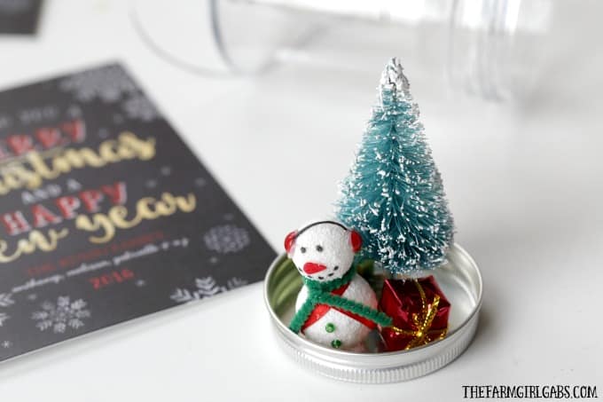 This DIY Snowman Snow Globe Ornament is an easy holiday craft to give along with your family Christmas card.