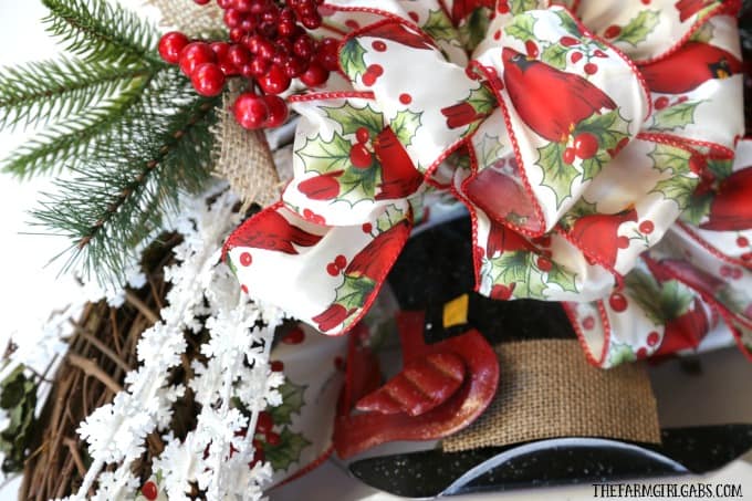 Brighten your Christmas decor with this simple DIY Jolly Snowman Christmas Wreath. This holiday craft idea is perfect hanging on a door at home.