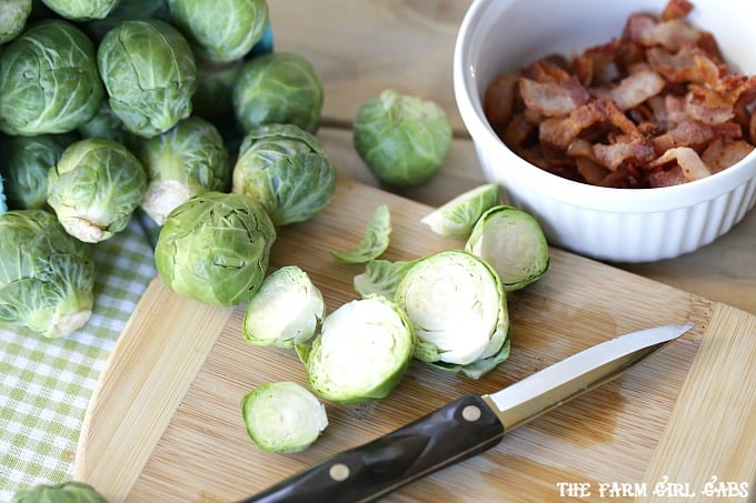 Pan Seared Brussels Sprouts With Bacon are a super quick side dish ready in 20 minutes flat! It's the perfect recipe to serve at Thanksgiving or for a weeknight meal. #SideDish #Recipe