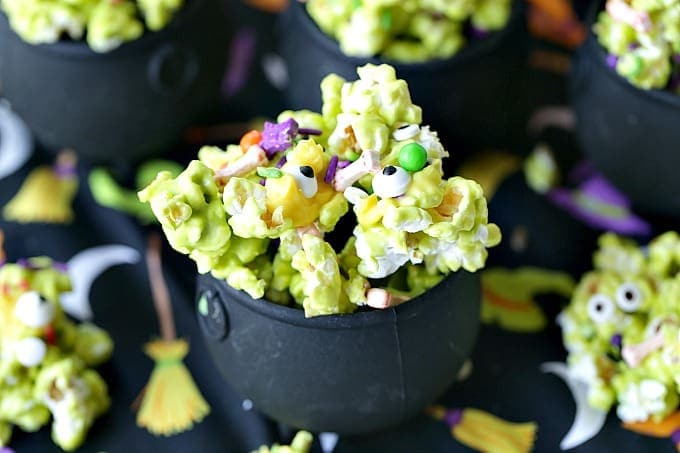 Double, double toil and trouble, Fire burn, and cauldron bubble. Stir up a batch of this ghoulish Cauldron Corn for some Halloween fun. #Halloween #Halloweenparty #HalloweenCandy #Snacks #Popcorn