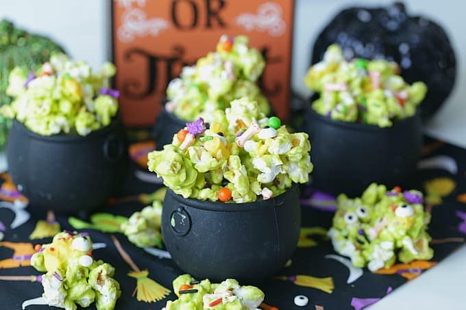 Double, double toil and trouble, Fire burn, and cauldron bubble. Stir up a batch of this ghoulish Cauldron Corn for some Halloween fun. #Halloween #Halloweenparty #HalloweenCandy #Snacks #Popcorn