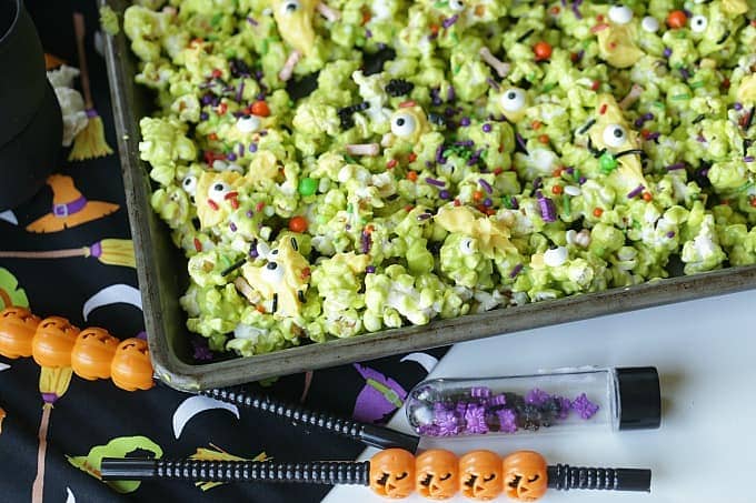 Double, double toil and trouble, Fire burn, and cauldron bubble. Stir up a batch of this ghoulish Cauldron Corn for some Halloween fun. #Halloween #Halloweenparty #HalloweenCandy #Snacks #Popcorn