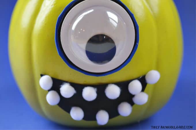 Add a little scare to your Halloween with this easy DIY No-Carve Mike Wazowski Pumpkin. This craft is perfect for a very Disney Halloween. #DisneyCraft #Pixar #MonstersInc #WaltDisneyWorld #DisneyCraft #Pumpkin #HalloweenDecor