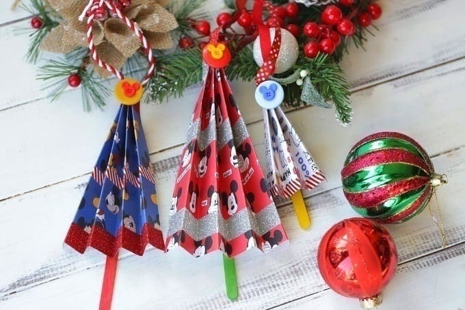 Add a magical touch to your Christmas tree with this easy Disney Accordion Tree Ornaments craft. Kids will love to create these Disney ornaments. #Disney #DisneyCraft #DisneyChristmas #ChristmasOrnaments #ChristmasDecorations #XmasDecor #MickeyMouse