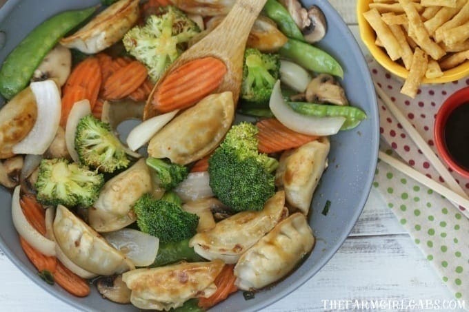 Celebrate the Chinese New Year with this easy make at home Potsticker Stir Fry Rice Bowl. Ling Ling Potstickers are so delicious. (AD) #LingLingAsian #LL #Stirfry #ChineseFood #Potstickers #ChineseNewYear