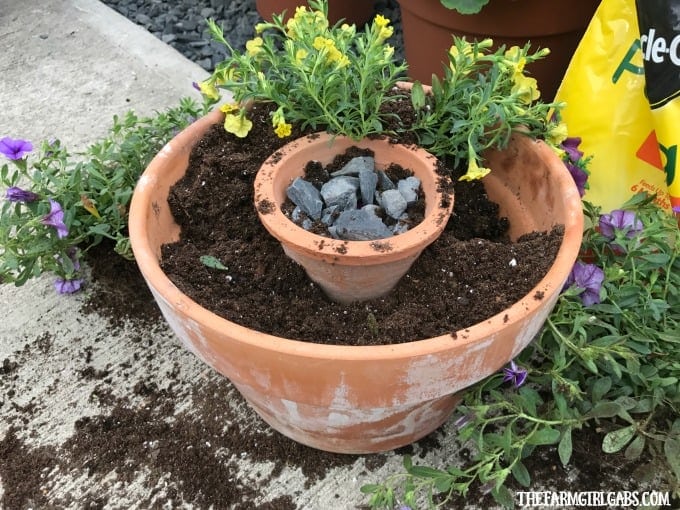 Beautify your backyard decor with this pretty Terra Cotta Candle Planter. This simple DIY candle planter will add some pretty ambiance to your patio.