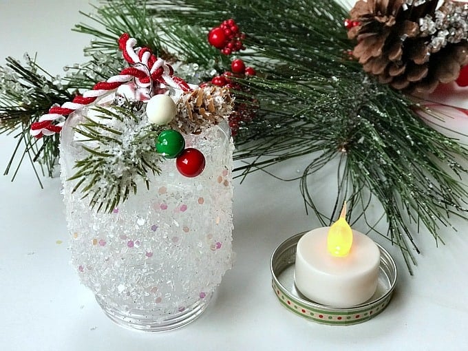 This easy DIY Snowy Lantern Ornament will shine brightly on your Christmas tree.