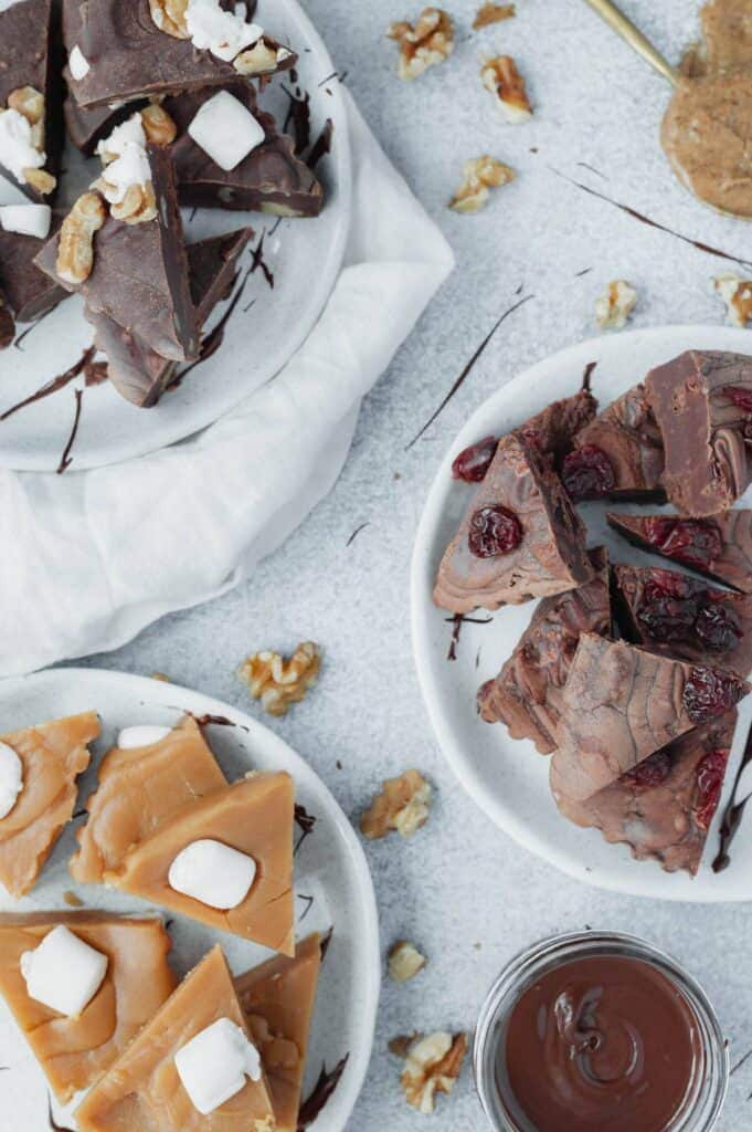 Overhead of vegan fudge on matte ceramic plates.