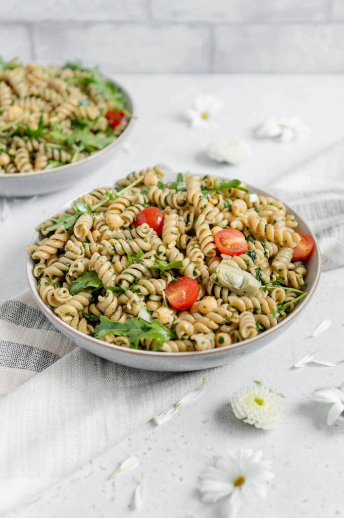 A big bowl of a pesto summer pasta salad.
