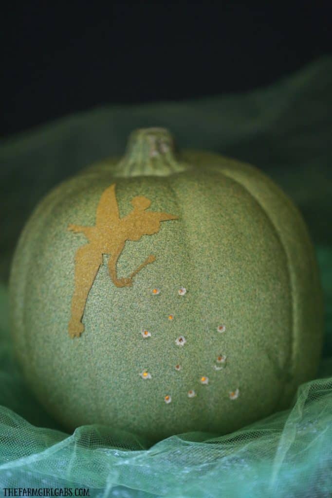 Celebrate Halloween with a little faith, trust, and this Tinker Bell Illuminated Pixie Dust Pumpkin. Create your own with this easy tutorial.