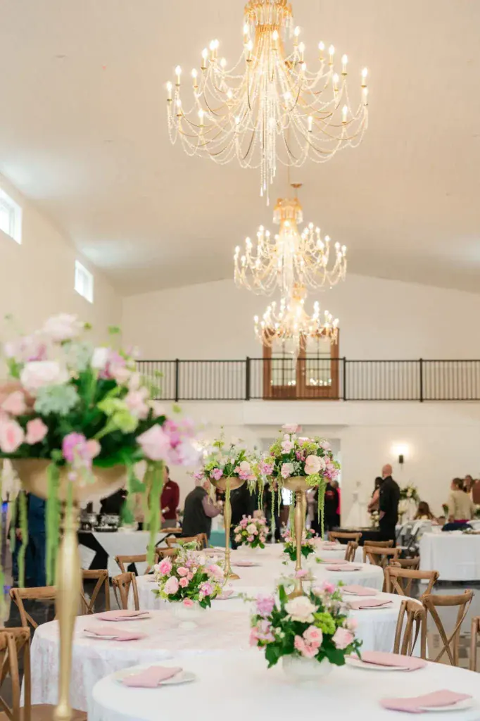 Grand Hall chandelier and florals at Romaine Valley, a holiday party venue in Fenton, MO