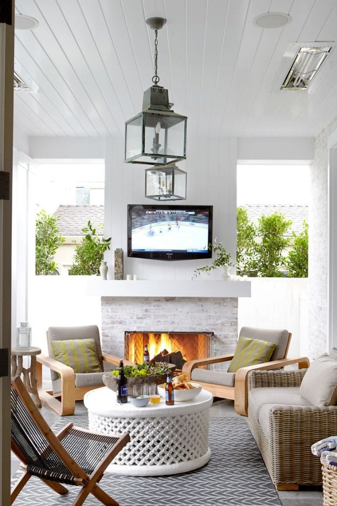 fireplace decorating ideas 57 Easy Fireplace Decorating Ideas That’ll Look Stylish All Year Long 54c15b01ee25a   07 hbx outdoor tv 1111 de 682x1024