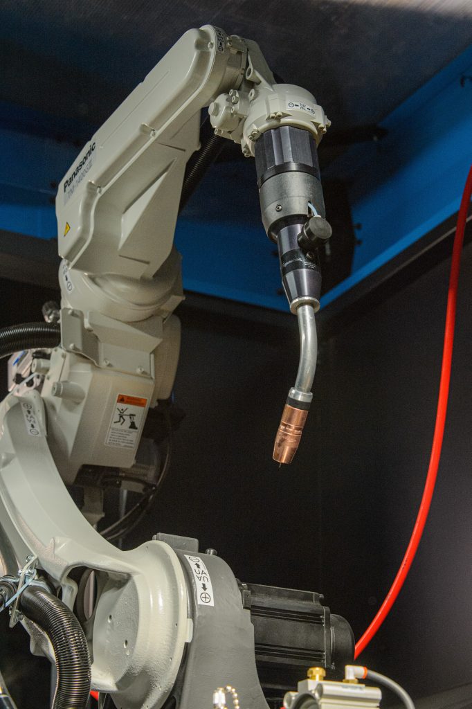 Robotic arm with robotic MIG gun in place