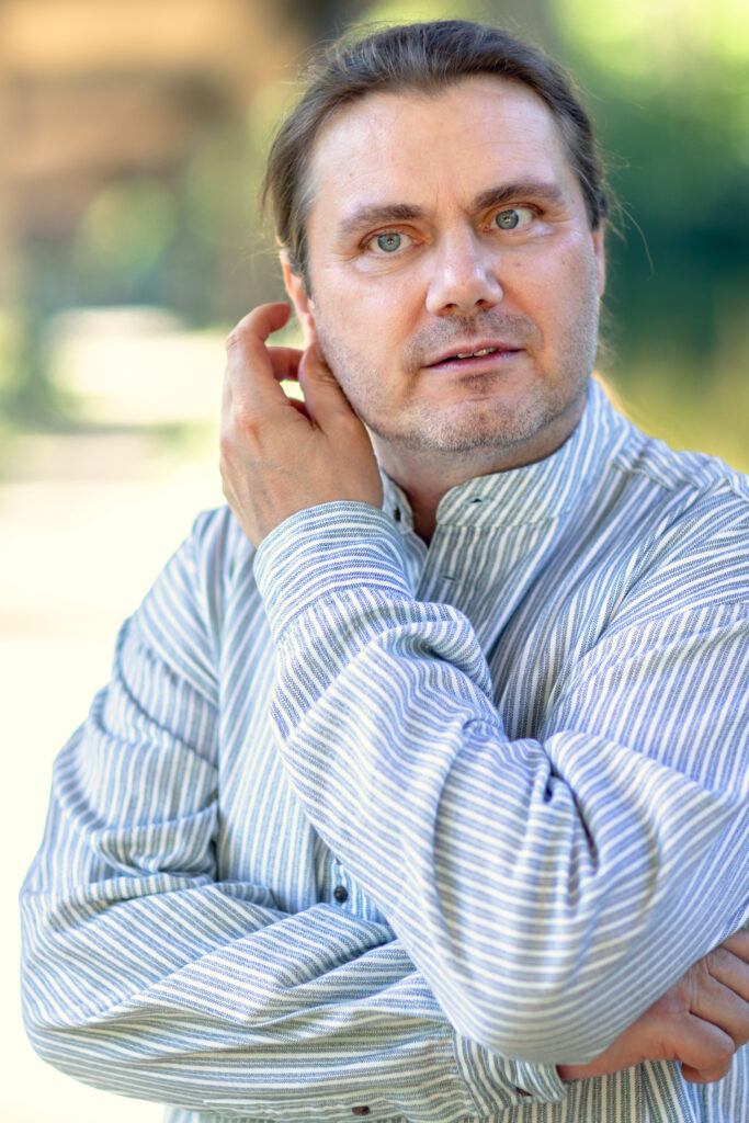 Marc Haunschild, scratching his right ear with left hand